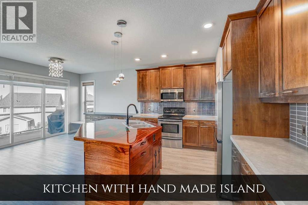 129 Pantego Bay Nw, Calgary, Alberta T3K 0B7 - Photo 7 - A2255406