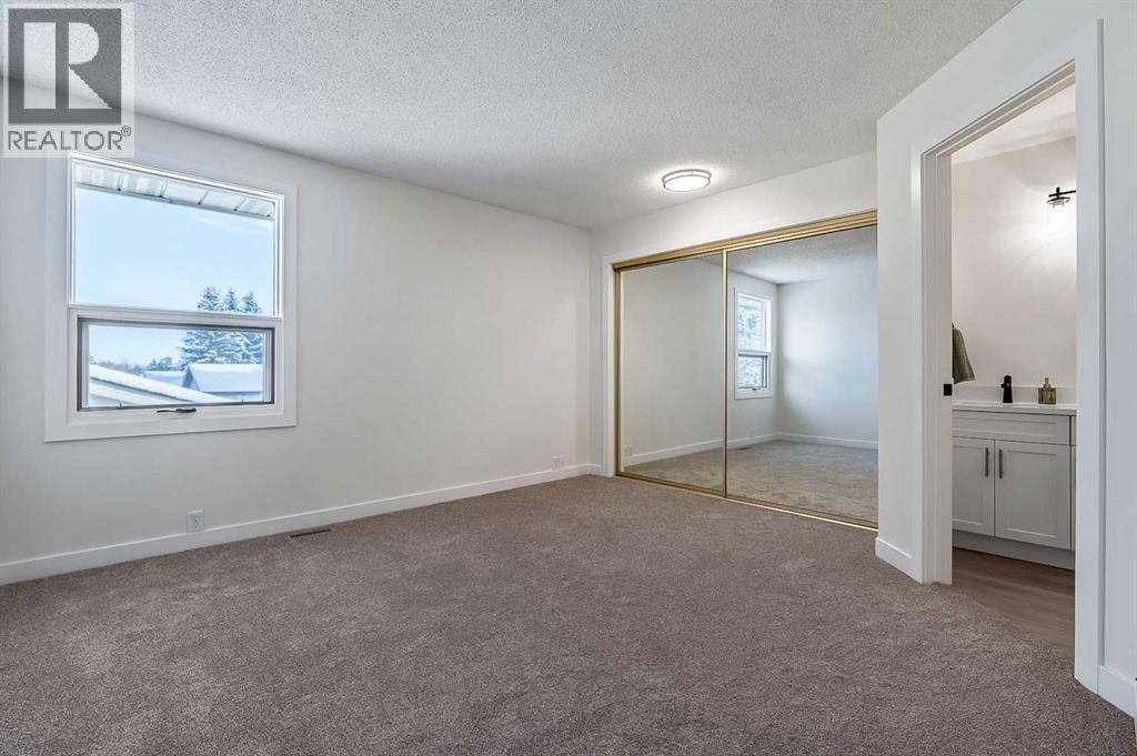 15 Woodford Crescent Sw, Calgary, Alberta T2W 4C5 - Photo 12 - A2272502