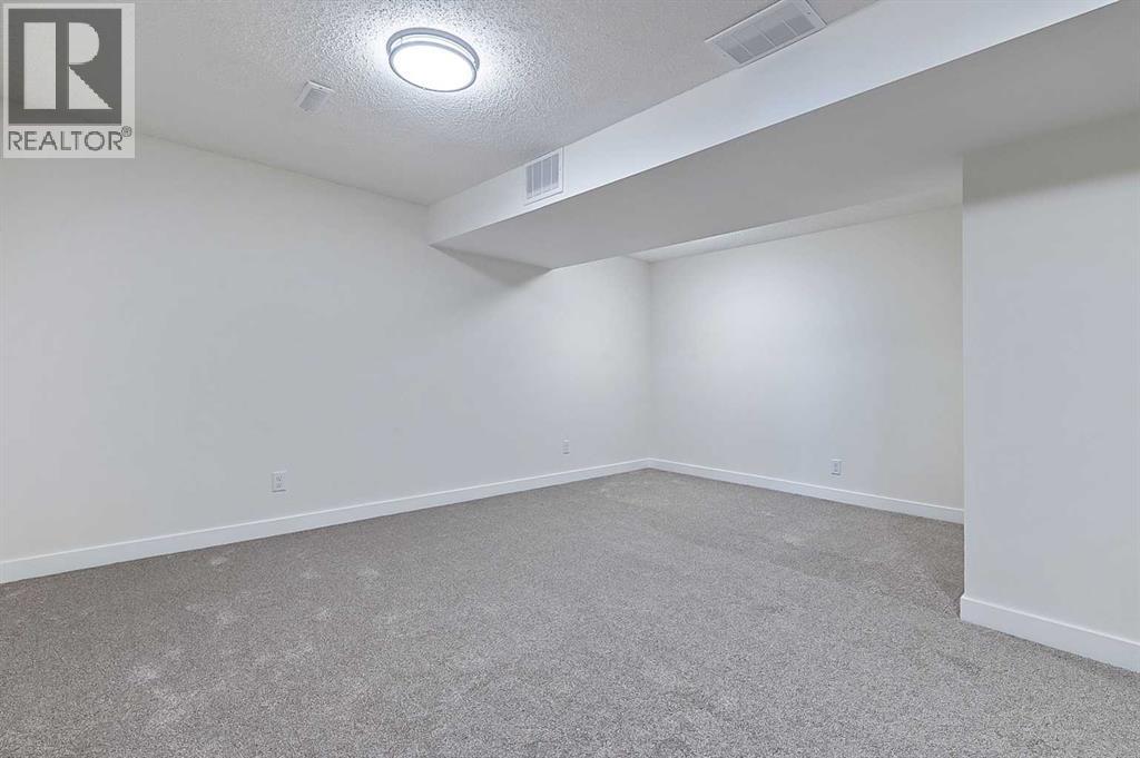 15 Woodford Crescent Sw, Calgary, Alberta T2W 4C5 - Photo 29 - A2272502