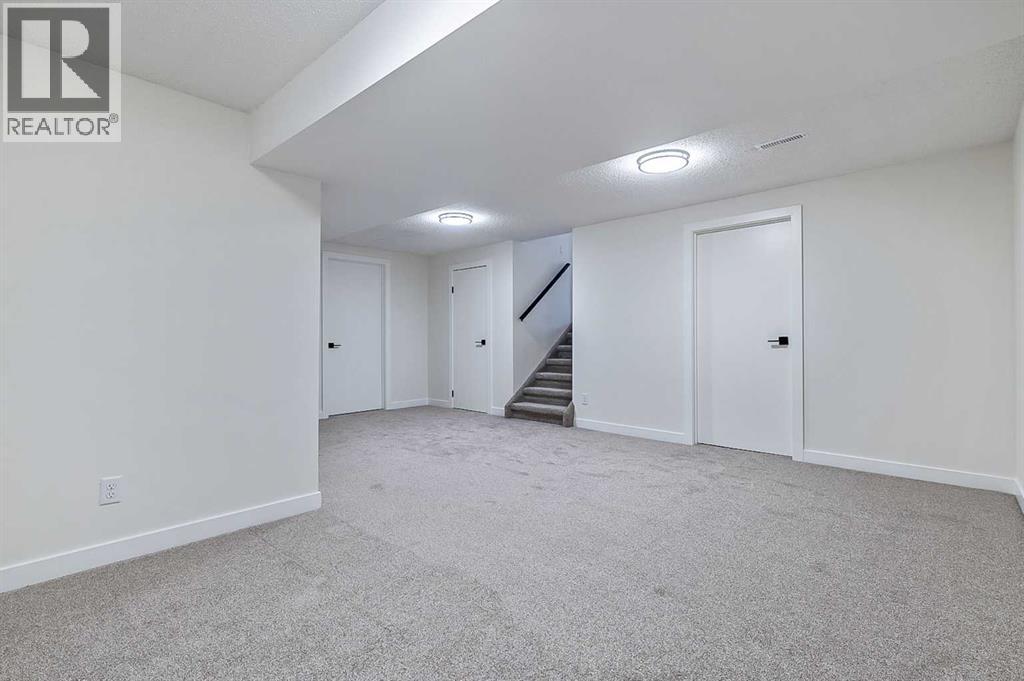 15 Woodford Crescent Sw, Calgary, Alberta T2W 4C5 - Photo 31 - A2272502