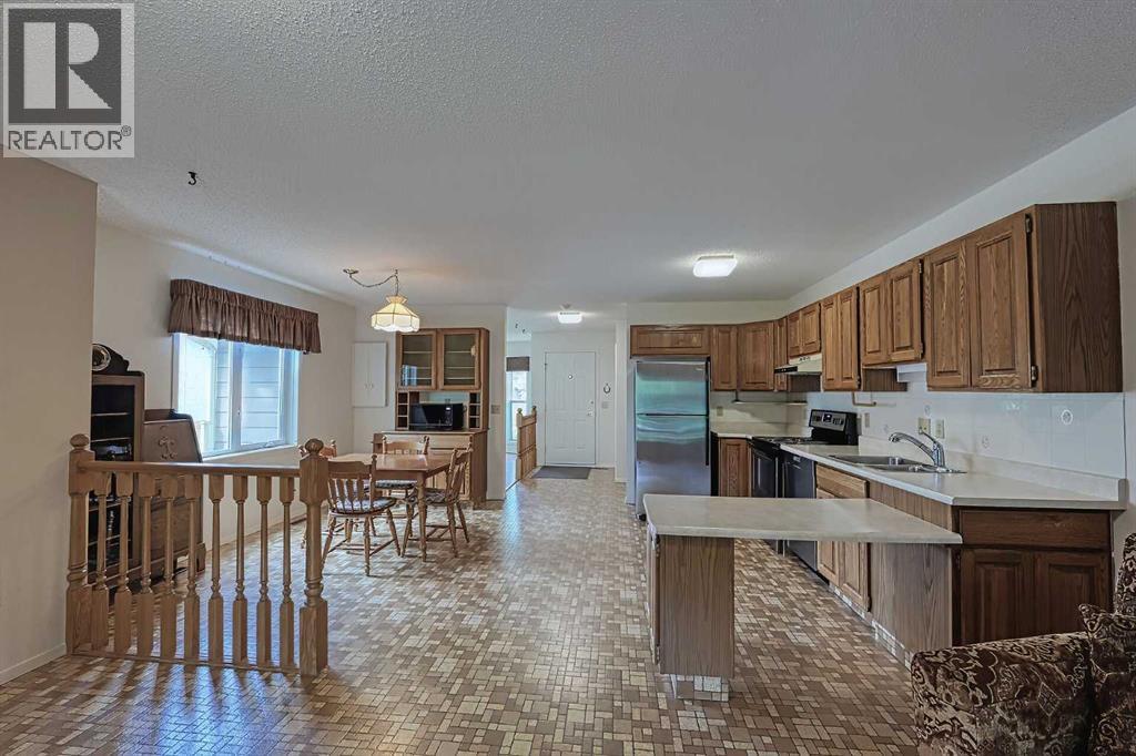 21 Welch Crescent, Okotoks, Alberta  T1S 1H2 - Photo 8 - A2267390