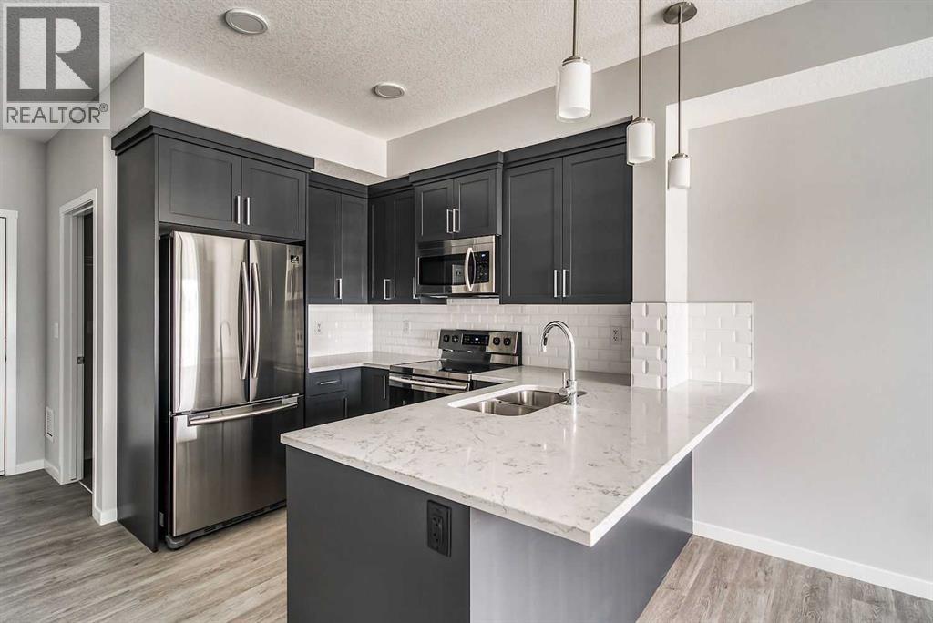 215, 300 Harvest Hills Place Ne, Calgary, Alberta  T3K 2P4 - Photo 3 - A2247917