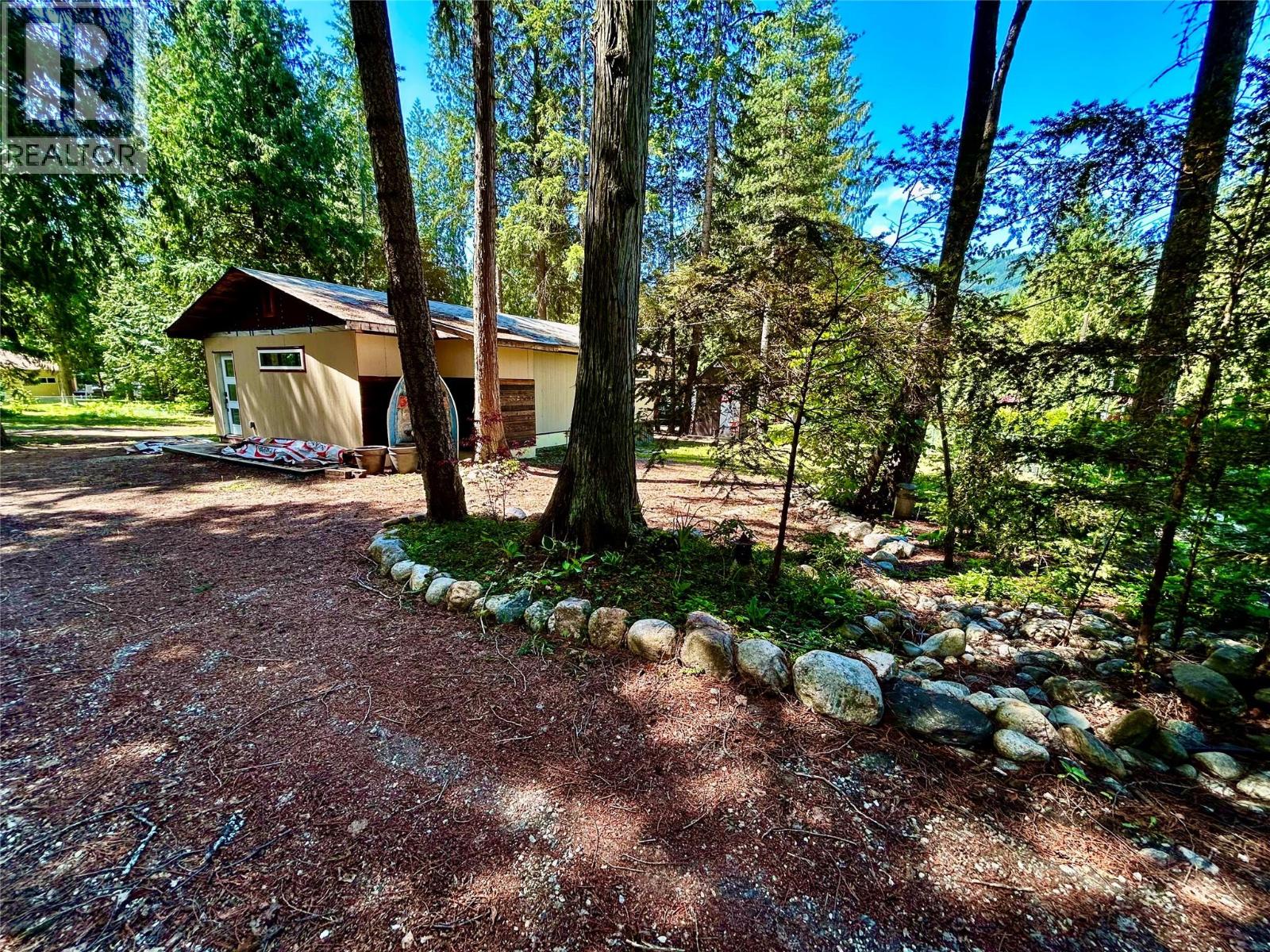 This unique .52 ACRE LOT in highly sought after Swansea Point is priced BELOW ASSESSED VALUE.  A rare opportunity to develop and complete a dream residence, this rancher is fully framed for open concept living with kitchen, main bathroom, great room, primary bedroom and ensuite bathroom with walk-in closet. Completed work includes new windows, 200amp electrical, roughed-in plumbing and in-floor radiant heat; while the exterior is clad with durable cement board siding (ready to paint). Co-operative water (Fallen Rock Water Society) and sewer make this site ready for customizing your home or investment property.  Beautiful garden doors open to the private south facing yard which boasts massive cedar trees, a flat site and RV hookup - just build your new deck and enjoy morning coffee in complete privacy or long summer evenings overlooking your oasis. Development possibilities are endless - CSRD approval is in place for a 30x50 garage w/studio, plans are available.  Mara Lake is steps away, as are several public beaches and a public boat launch. Swansea Point is 1.5 hr to Kelowna International Airport (YLW), 1 hour to Silver Star Mountain and 1 hour to Revelstoke Mountain Resort. CSRD Building Permit remains open until March 2026. *LIVE & LOVE LAKE LIFE* (id:48254)