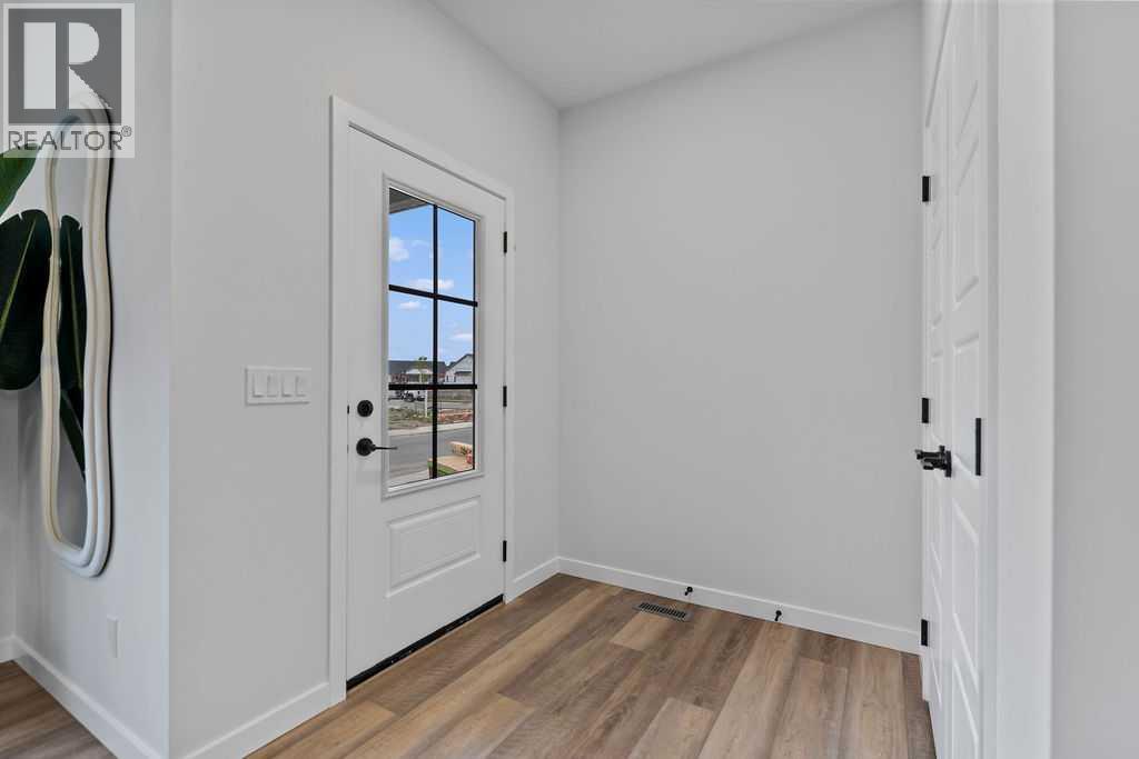 1037 Reynolds Crescent Sw, Airdrie, Alberta  T4B 5L8 - Photo 3 - A2201126