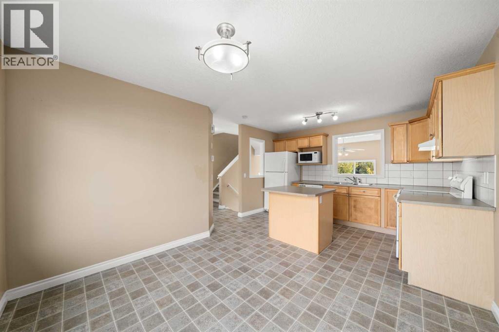 70 Crystal Shores Cove, Okotoks, Alberta  T1S 2B4 - Photo 8 - A2260860