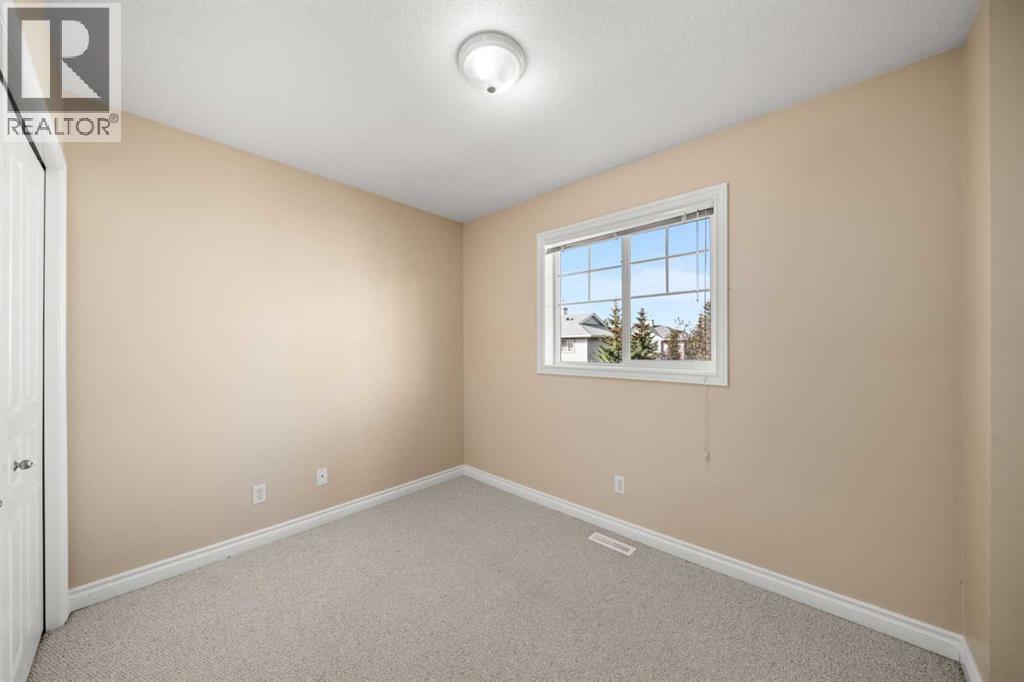 70 Crystal Shores Cove, Okotoks, Alberta  T1S 2B4 - Photo 19 - A2260860