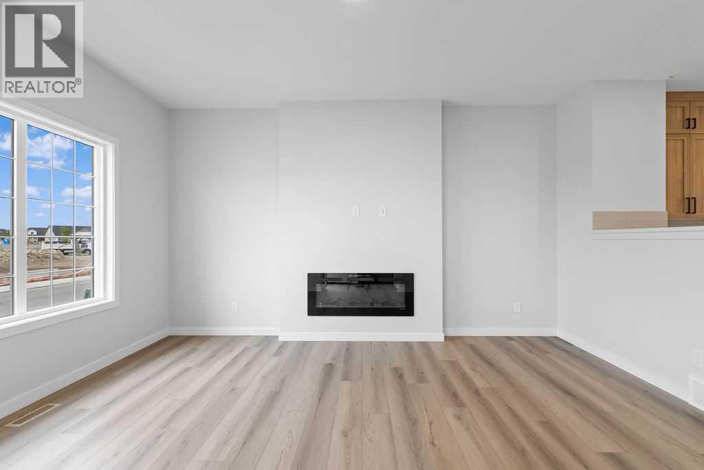 1025 Reynolds Crescent Sw, Airdrie, Alberta  T4B 5L8 - Photo 4 - A2199712