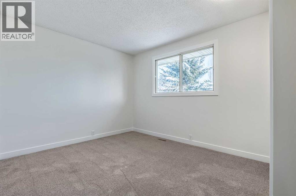 15 Woodford Crescent Sw, Calgary, Alberta  T2W 4C5 - Photo 18 - A2272502