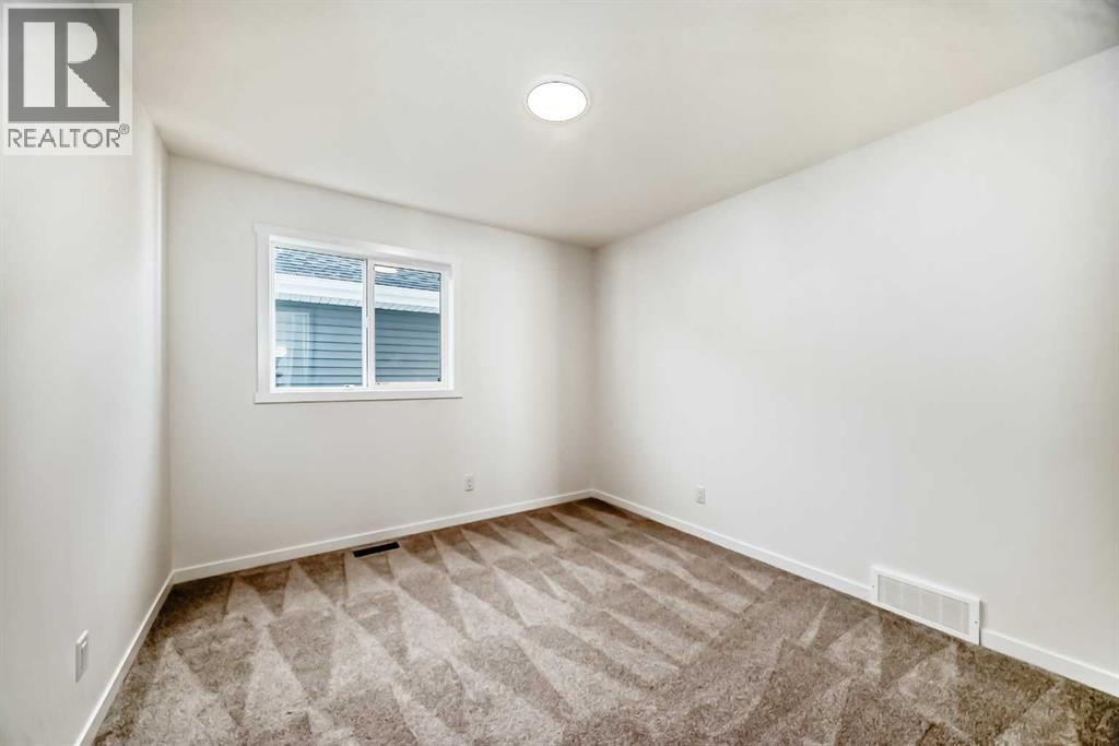 168 Southborough Common, Cochrane, Alberta T4C 3J5 - Photo 32 - A2273060