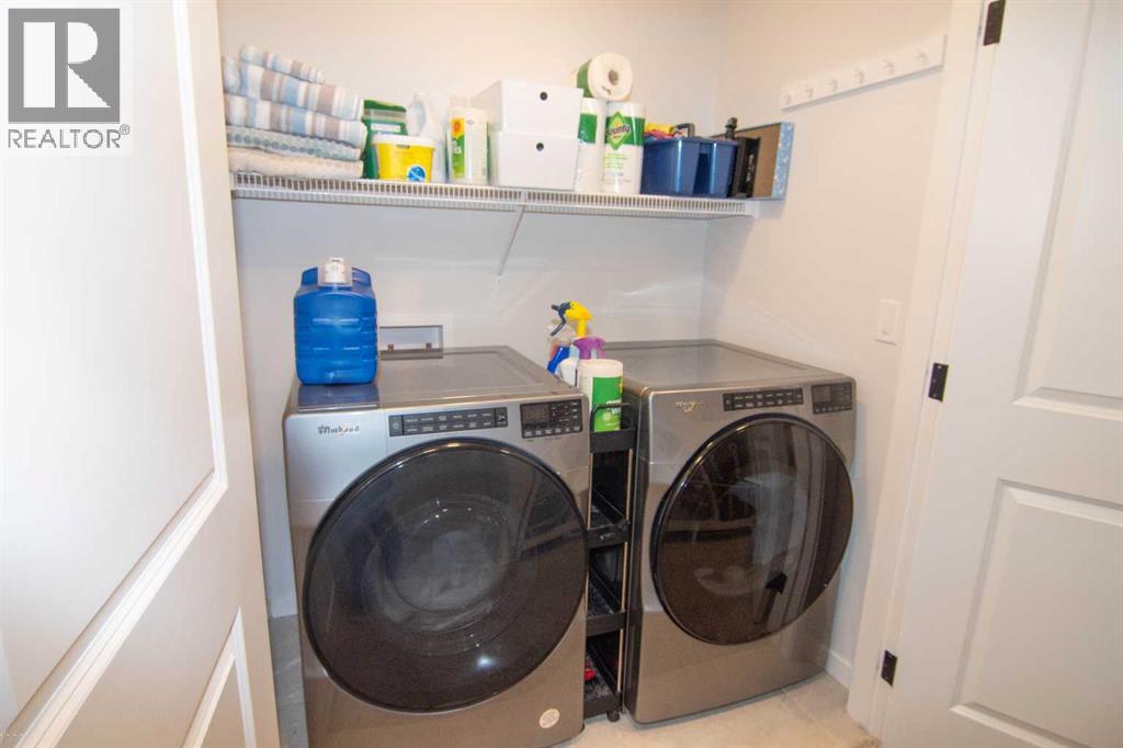 551 Wolf Creek Way Se, Calgary, Alberta  T2X 4Y9 - Photo 22 - A2275232