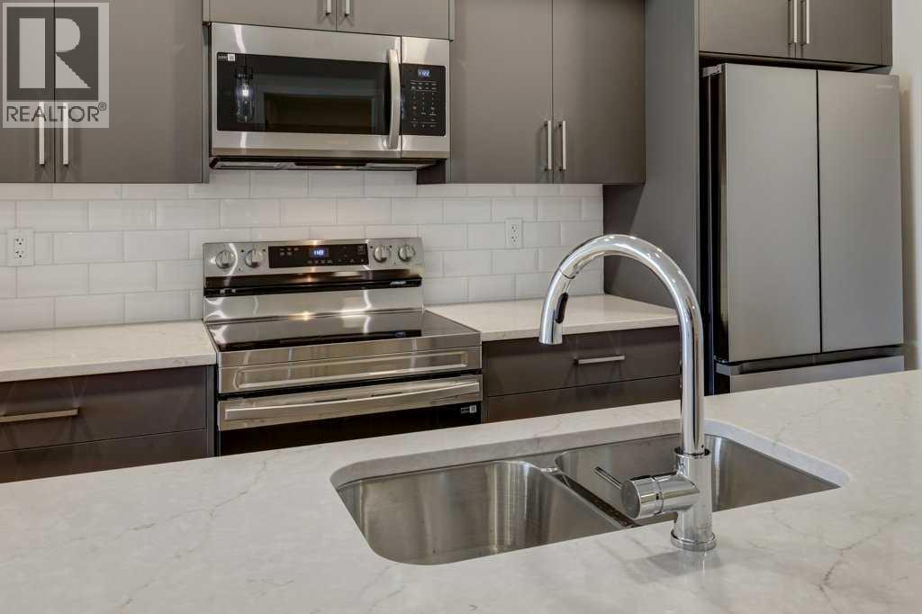 219, 245 Edith Place Nw, Calgary, Alberta  T3R 2C9 - Photo 6 - A2275303