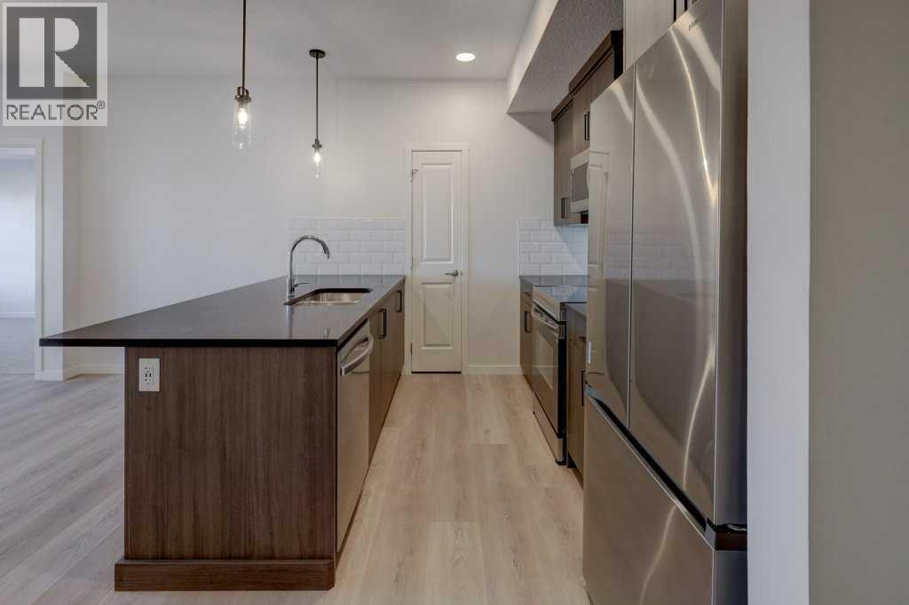 211, 245 Edith Place Nw, Calgary, Alberta  T3R 2C9 - Photo 7 - A2275304