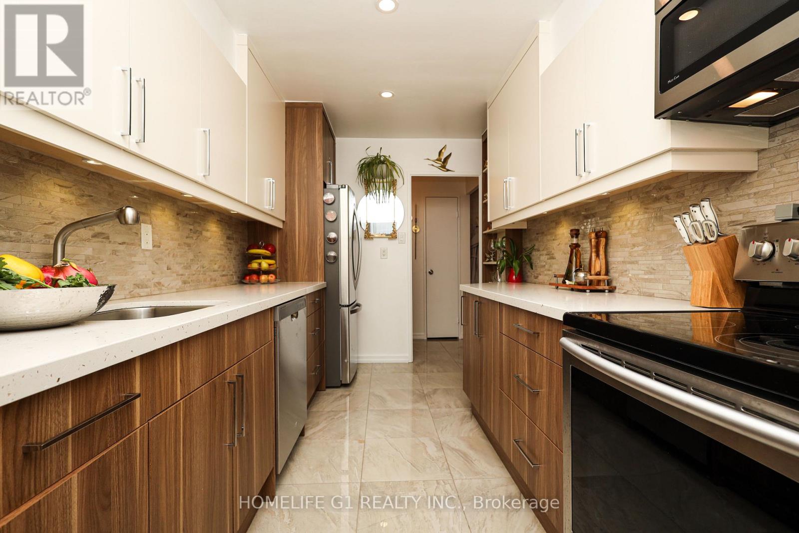 1203 - 44 Longbourne Drive, Toronto, Ontario  M9R 2M7 - Photo 4 - W12646880