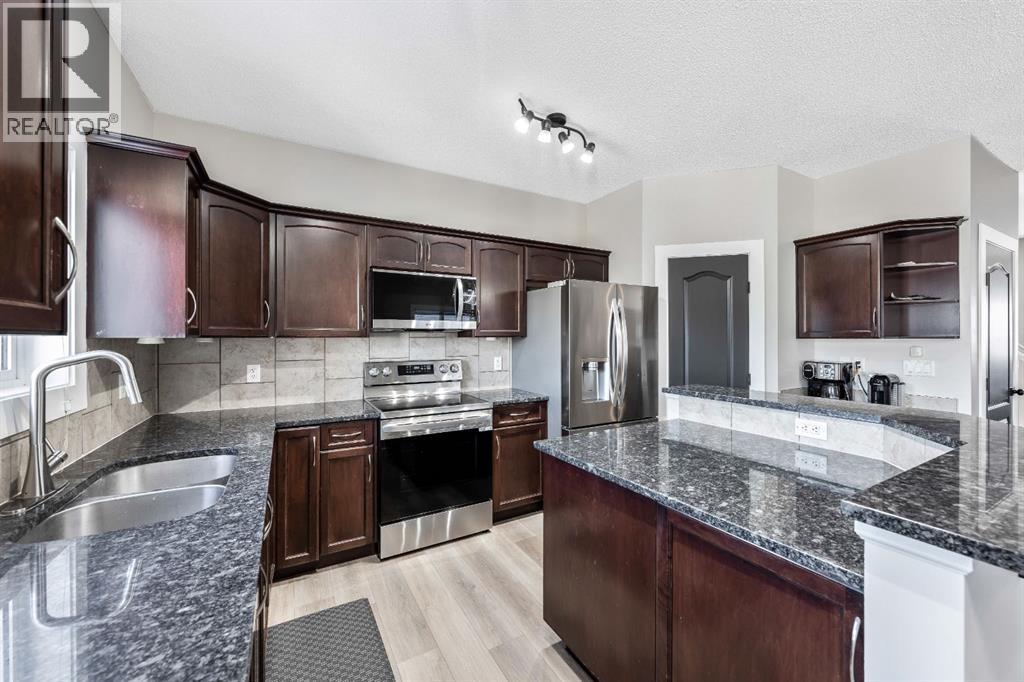 84 Cimarron Grove Close, Okotoks, Alberta  T1S 0H5 - Photo 11 - A2275647