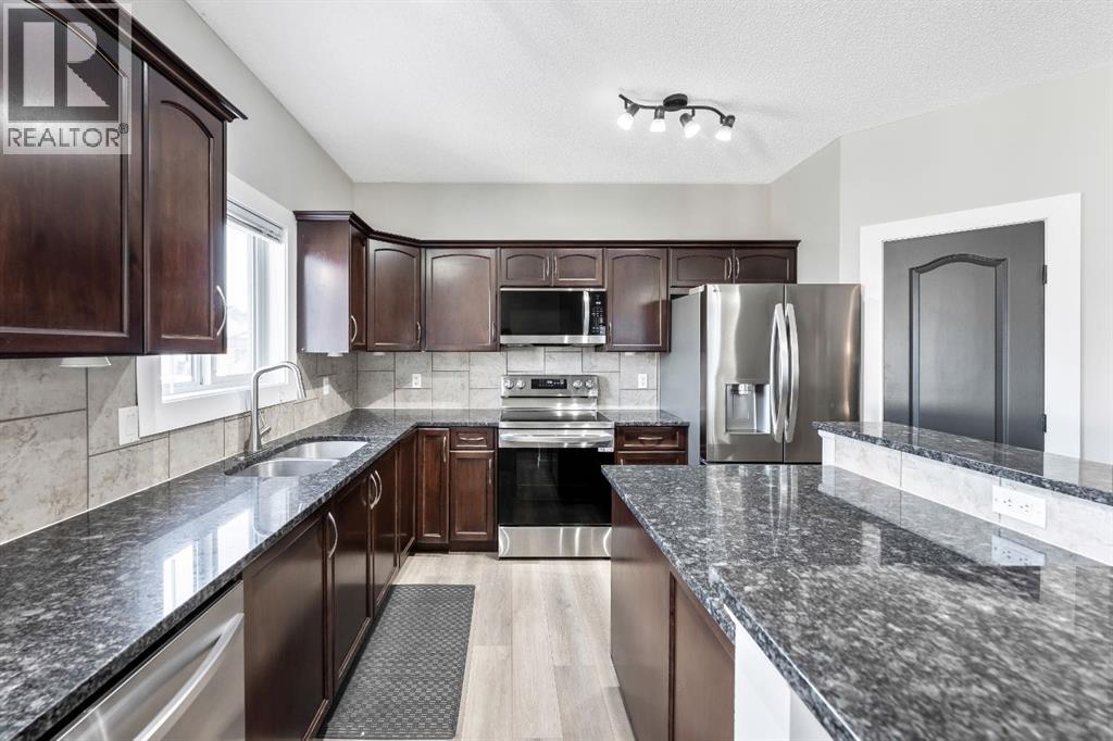 84 Cimarron Grove Close, Okotoks, Alberta  T1S 0H5 - Photo 10 - A2275647