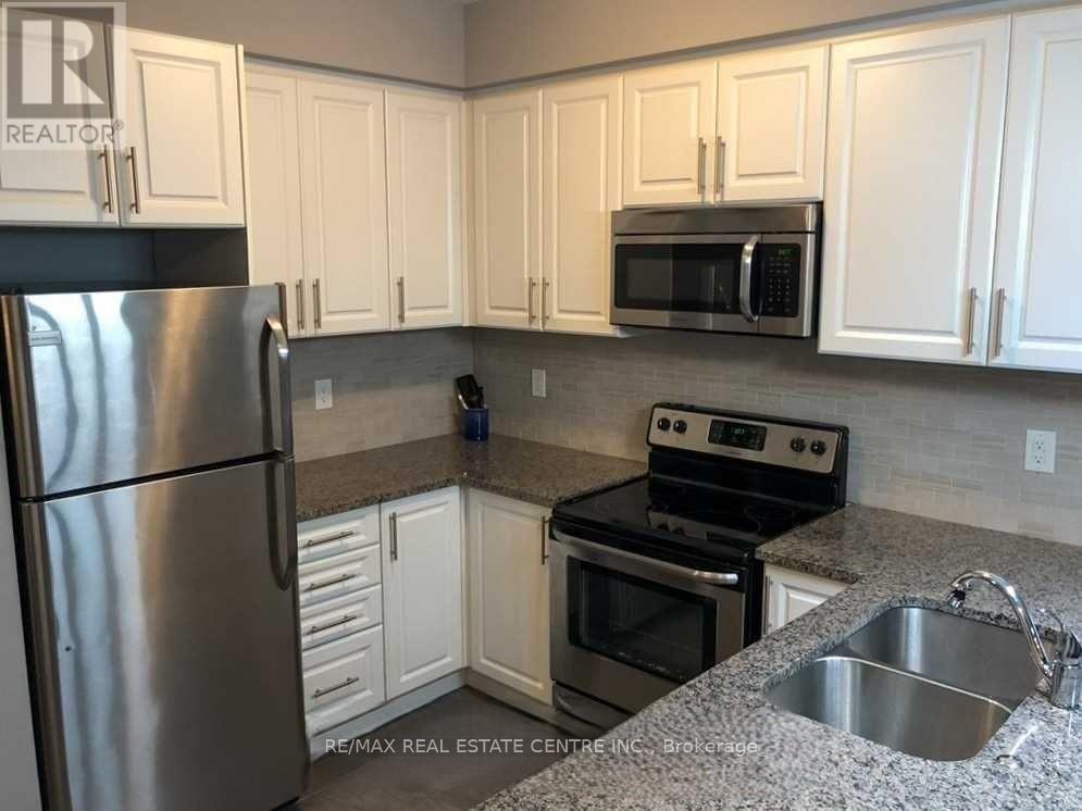 208 - 263 Georgian Drive, Oakville (Ro River Oaks), Ontario  L6H 0L2 - Photo 4 - W12647816