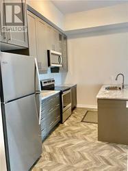 512 - 150 Oak Park Boulevard, Oakville, Ontario  L6H 3P2 - Photo 6 - W12648858