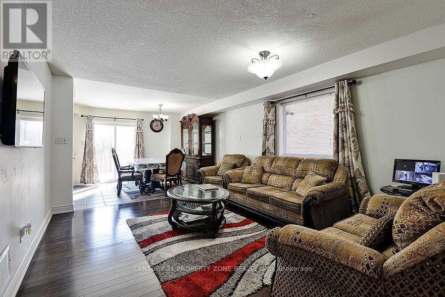 84 Tideland Drive, Brampton, Ontario  L7A 2W1 - Photo 3 - W12648924