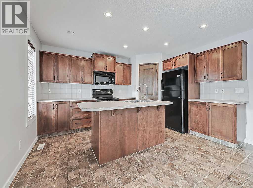 409 Cimarron Boulevard, Okotoks, Alberta  T1S 0A9 - Photo 6 - A2269381