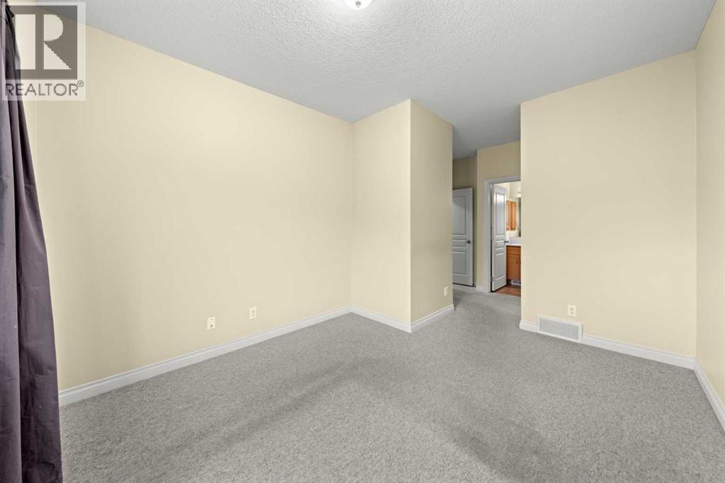 116 Tucker Circle, Okotoks, Alberta  T1S 2J8 - Photo 17 - A2271009