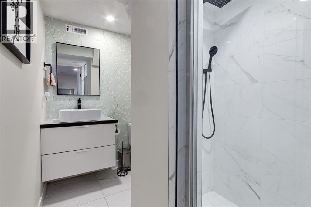 5 Sydney Drive Sw, Calgary, Alberta  T2W 0S7 - Photo 28 - A2269400