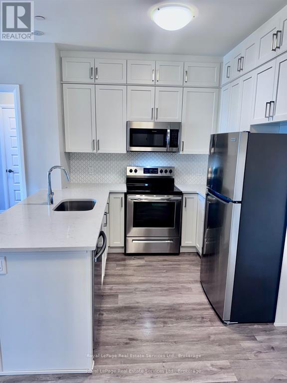 511 - 95 Dundas Street W, Oakville, Ontario  L6M 5N4 - Photo 5 - W12654816