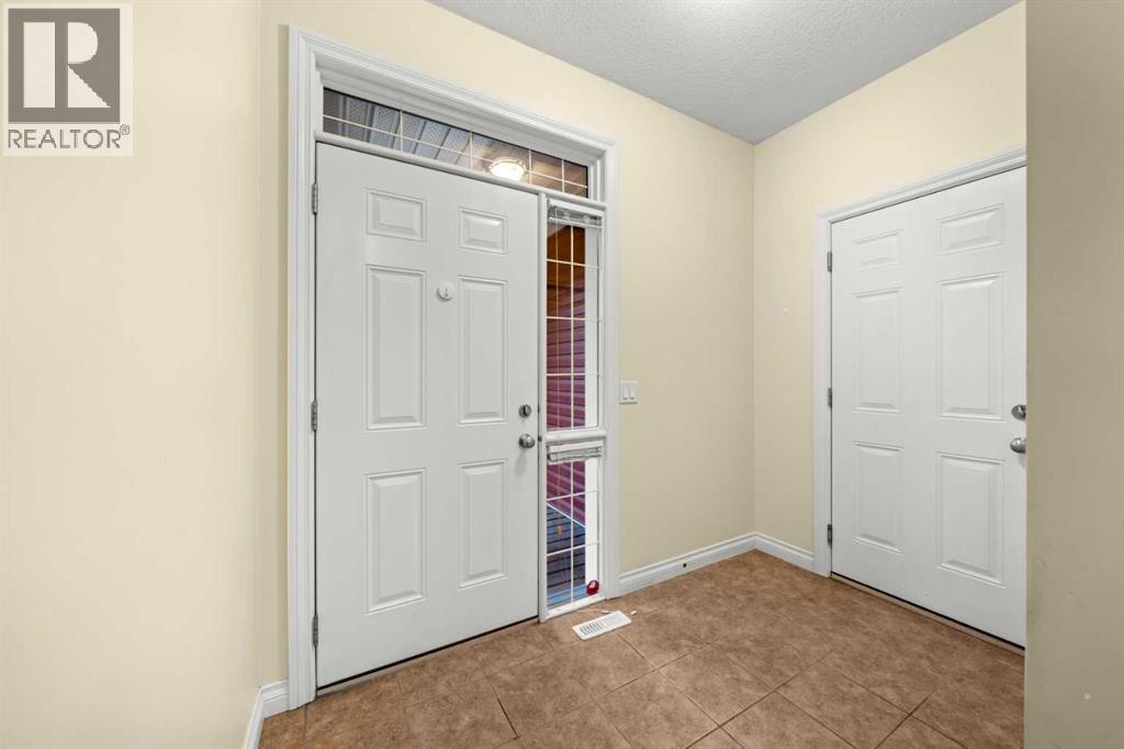 116 Tucker Circle, Okotoks, Alberta  T1S 2J8 - Photo 3 - A2271009