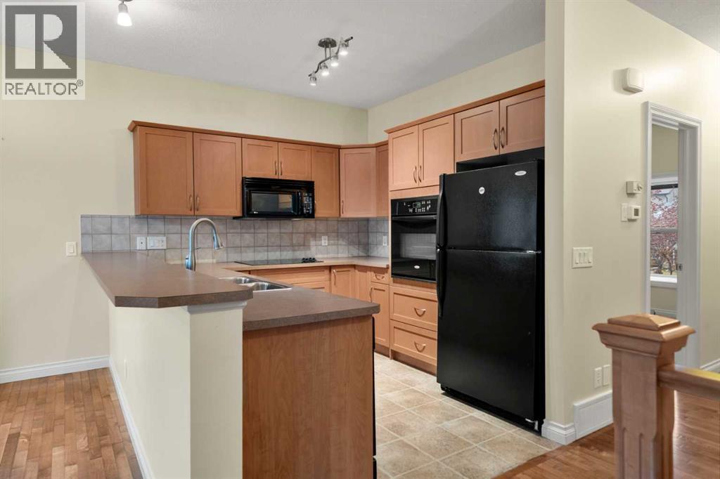 116 Tucker Circle, Okotoks, Alberta  T1S 2J8 - Photo 5 - A2271009