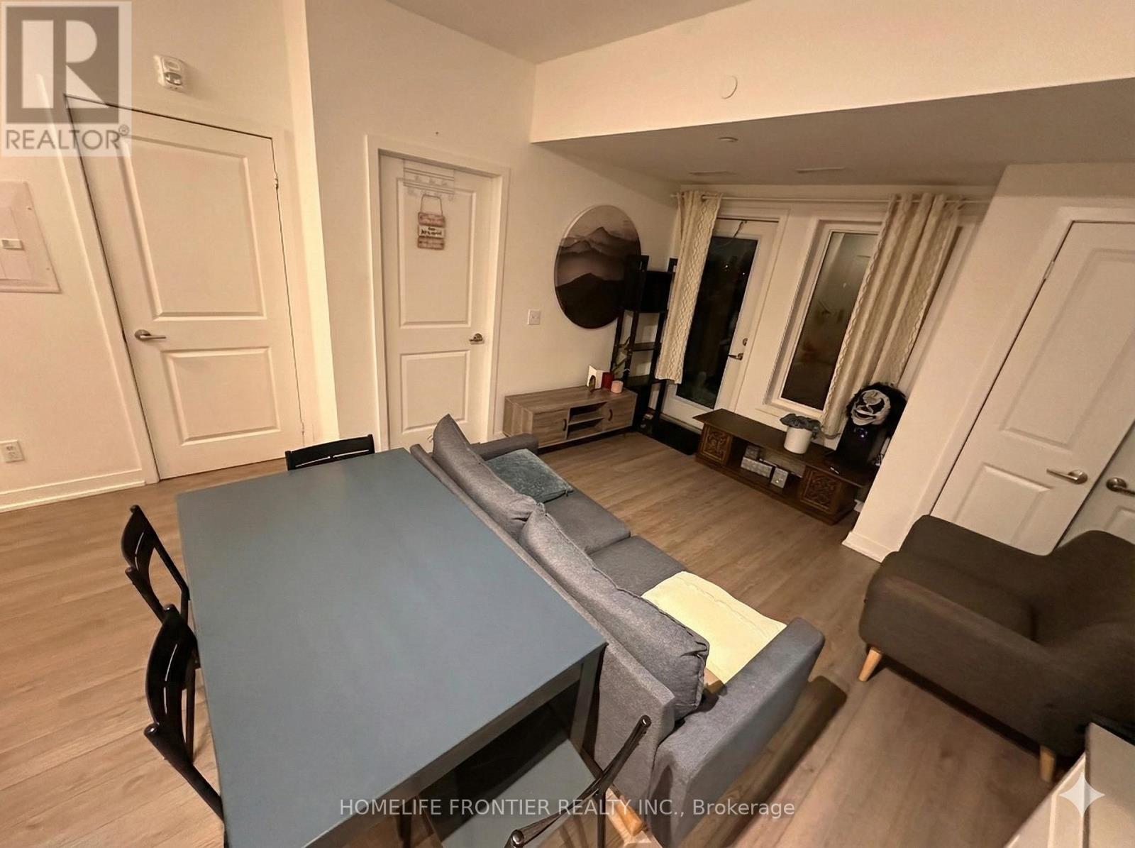 207 - 155 Downsview Park Boulevard, Toronto, Ontario  M3K 0E3 - Photo 2 - W12657510