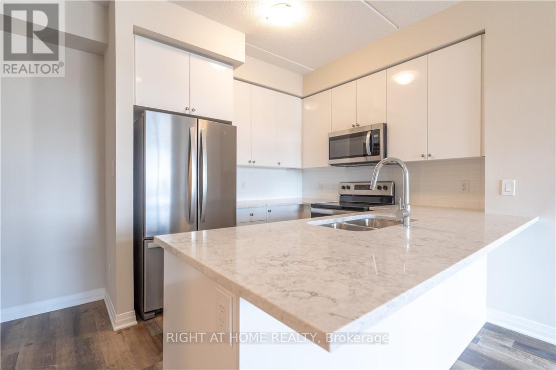 407 - 610 Farmstead Drive, Milton, Ontario  L9T 8X5 - Photo 7 - W12657798