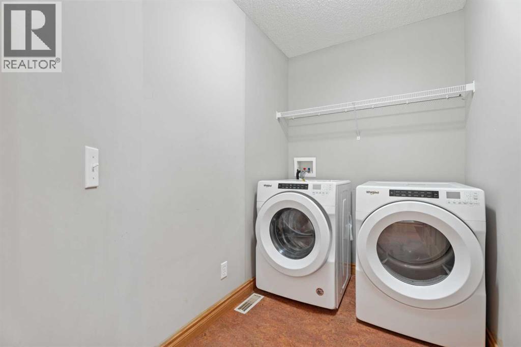 303 Drake Landing Close, Okotoks, Alberta  T1S 2M5 - Photo 30 - A2276612