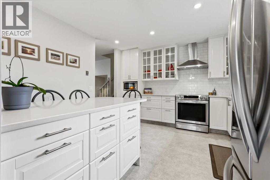 103 Sandarac Place Nw, Calgary, Alberta  T3K 2Y5 - Photo 2 - A2277271