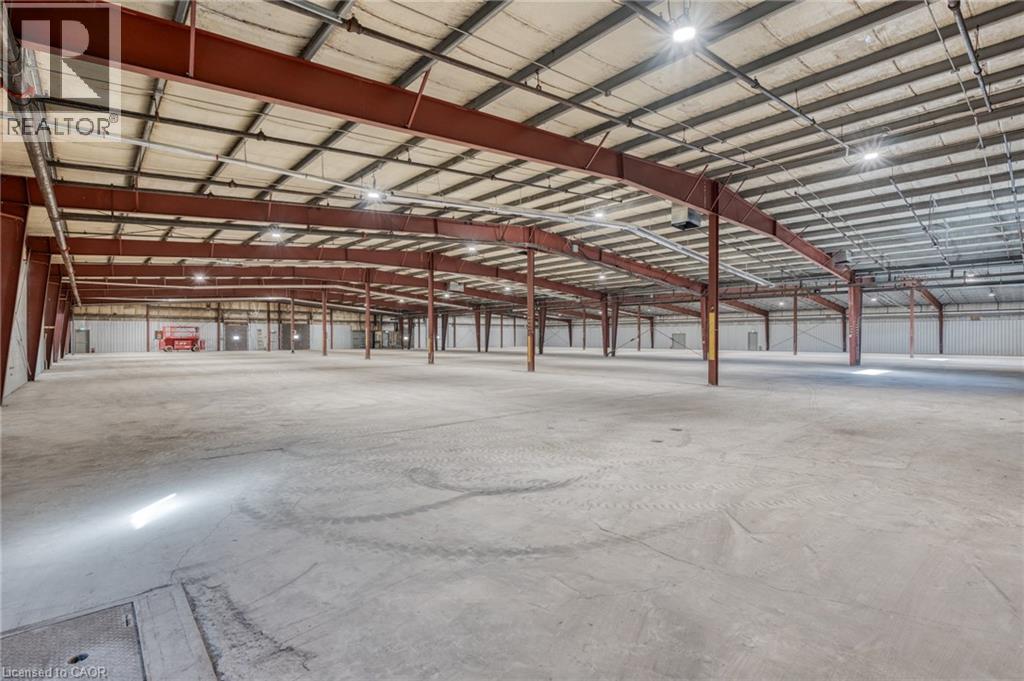 Prime industrial opportunity in Niagara Falls’ Stanley Avenue Business Park with multiple units and configurations of industrial space available for lease. This specific unit configuration is a fully upgraded and vacant 15,564 sq. ft. of space in the heart of the Stanley Avenue Business Park, only 5 minutes from the QEW, and 17 minutes from the Peace Bridge. The unit features a total of 2 bay doors, of which 1 is a drive-in door and 1 is a truck-level loading dock for seamless logistics. Recent enhancements include a fully fire-certified & monitored building with all-new sprinkler heads, new radiant tube heating, multiple rooftop HVAC units for heating and cooling, completely new Interior/Exterior LED lighting, and 1,200 amp 600 volt service! The property also has a brand-new torch-down roof over the flex space, along with fresh asphalt. The property has General Industrial zoning, which is ideal for manufacturing, a carpenter shop, laboratory, machine shop, warehouse, or the like. Outdoor surface parking is available. This business park has benefited from major infrastructure investments by the City of Niagara, and this turnkey space is truly a standout opportunity. Come see how this rare vacant gem can elevate your operations! (id:48254)