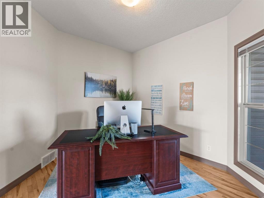 95 Crystal Shores Road, Okotoks, Alberta  T1S 2H9 - Photo 4 - A2277318