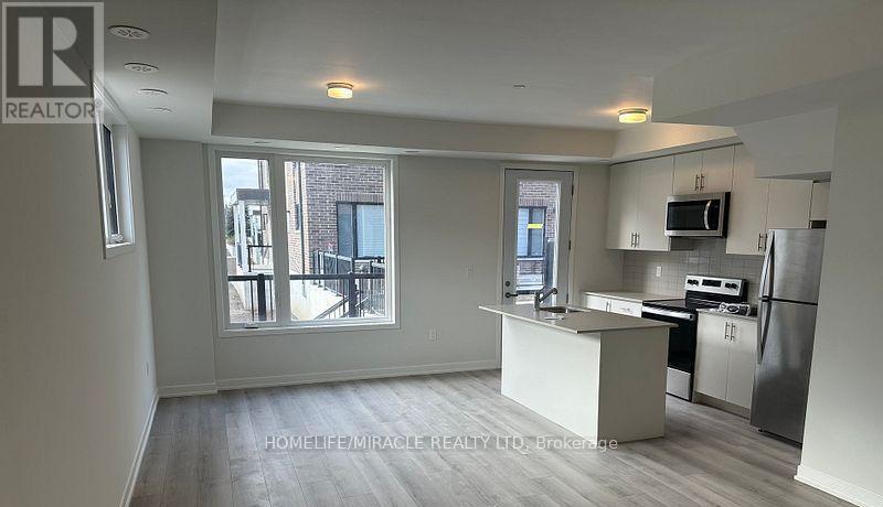 02 - 3415 Ridgeway Drive, Mississauga, Ontario  L5L 0B9 - Photo 3 - W12678334