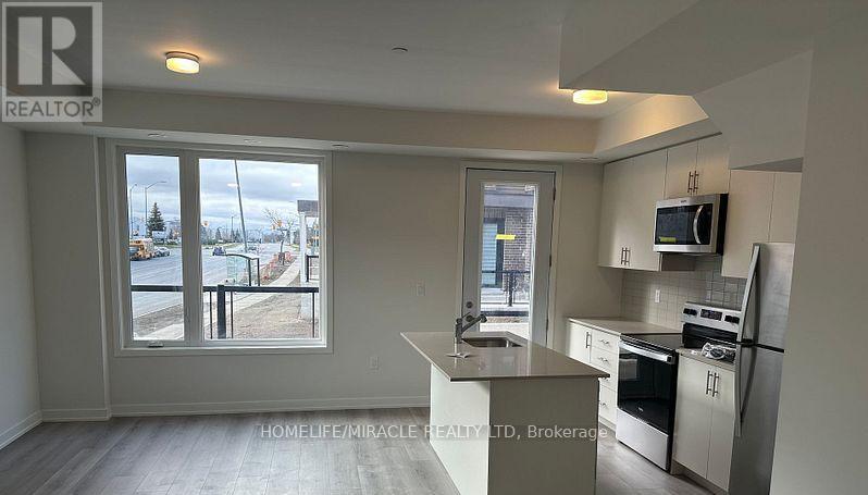 02 - 3415 Ridgeway Drive, Mississauga, Ontario  L5L 0B9 - Photo 4 - W12678334