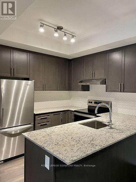 214 - 349 Wheat Boom Drive, Oakville, Ontario  L6H 7X5 - Photo 3 - W12680292