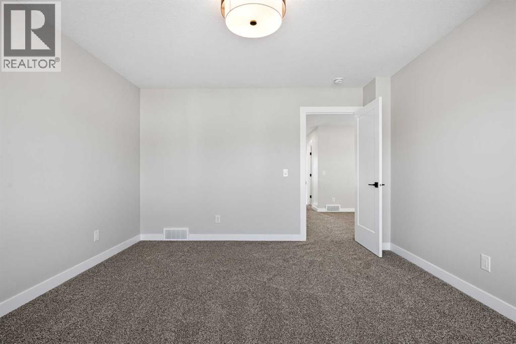 85 Quartz Crescent, Cochrane, Alberta  T4C 3G2 - Photo 21 - A2269392