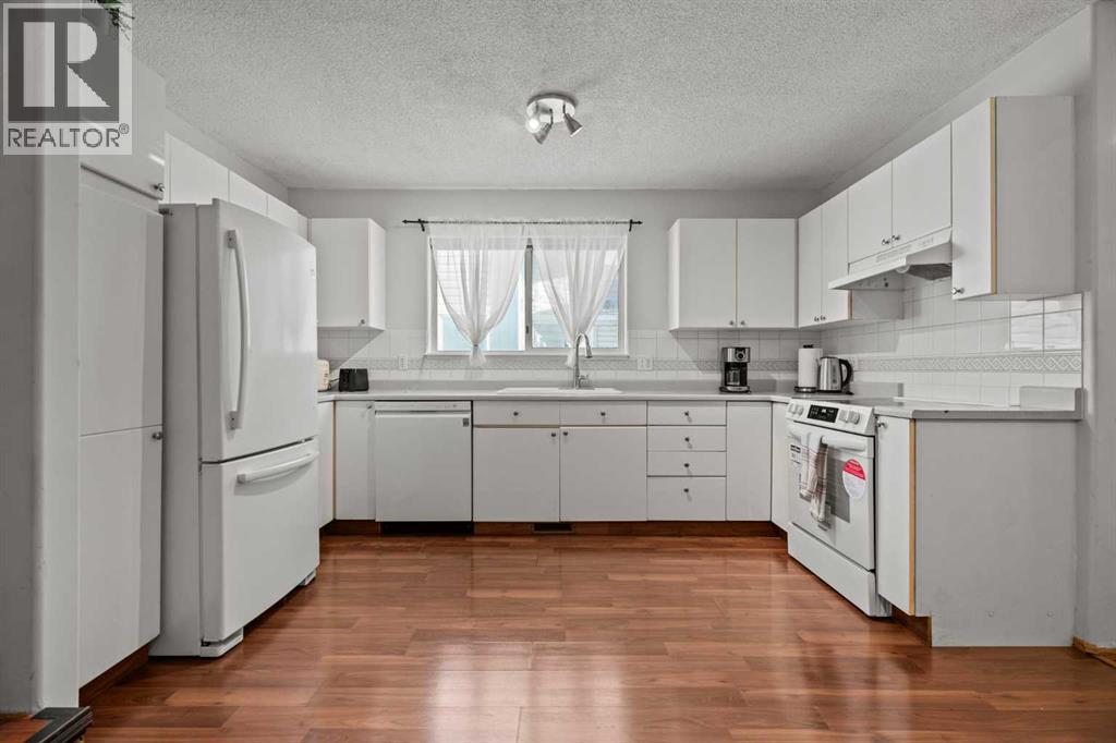 6938 Laguna Way Ne, Calgary, Alberta  T1Y 6W2 - Photo 11 - A2271088