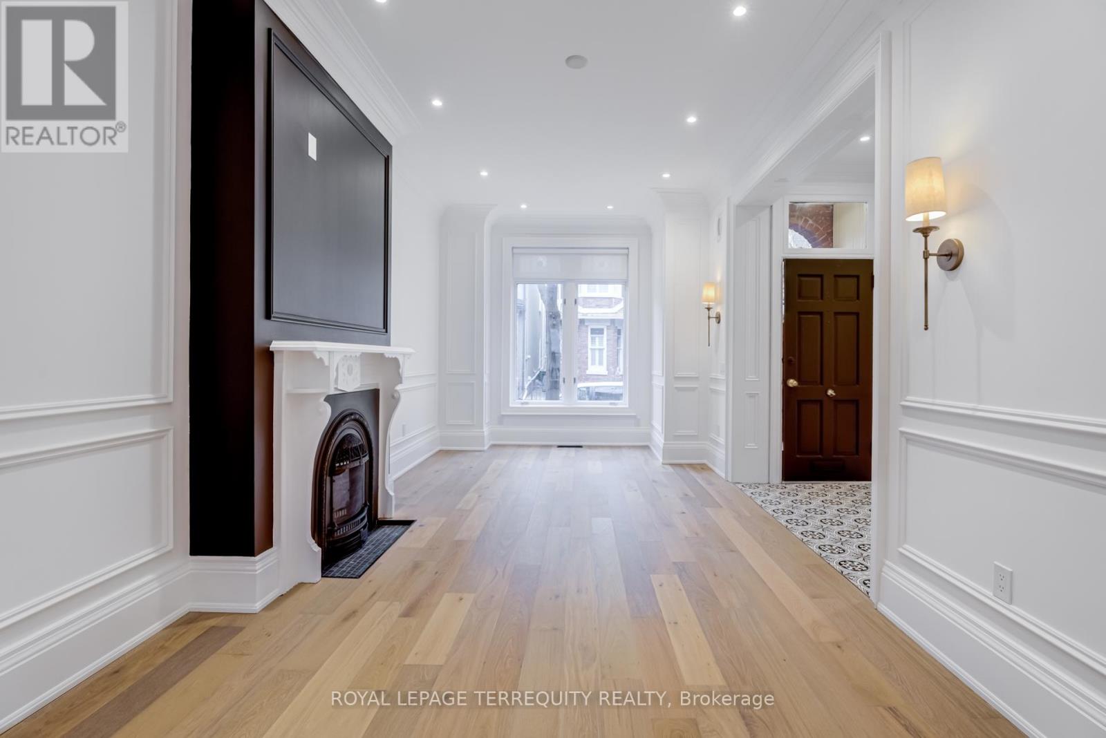 Modern Play on a Classic Victorian - A Masterpiece of Refined Elegance Nestled on a Quiet, Tree-Lined Street in The Heart of Coveted CabbageTown, This Residence Effortlessly Unites Victorian Heritage with Modern Sophistication. A Captivating Black-And-White Interior Palette Sets aDramatic Tone, Enhanced by Porcelain Floors and 90-Inch Custom Doors Throughout. The Foyer, Living, and Dining Areas Feature Wide-PlankEngineered Hardwood Floors, Crown Mouldings, and Intricate Wall Millwork, Creating an Atmosphere of Understated Grandeur. The Custom Eat-In Family Kitchen Is a Showpiece-Complete with a Built-In Coffee Station, Stainless-Steel Appliances, Book-Matched Quartz Counters &Backsplash, and a Walk-Out to the Private Backyard. The Primary Bedroom Retreat Is a Serene Sanctuary Highlighted by an Exposed BrickFeature Wall, Adding Warmth and Texture to Its Sophisticated Design. His-And-Hers Closets and an Elegant Ensuite with Double-Sink Vanity,Designer Lighting, Toto Toilet, and Oversized Glass Shower with Built-In Niche Complete the Suite. The Spa-Inspired Family Bath Boasts a 66-Inch Soaker Tub, Perfect for Relaxation. Two Additional Bedrooms Offer Distinct Outdoor Escapes-One with A Private Balcony ShowcasingPanoramic Downtown Views, and The Other with An Expansive Rooftop Terrace Is Ideal for Lounging or Entertaining. The Fully FinishedBasement Extends the Living Space with A Versatile Recreation Room, A Well-Appointed Laundry Area (Side-By-Side Washer, Dryer, Sink, &Folding Counter), Ample Closets, And A Walk-Out to the Backyard. The Curb-Less 3-Piece Bath with Glass Shower Exudes ContemporarySophistication. Every Inch of This Home Reflects Meticulous Craftsmanship, Thoughtful Design, And Move-In-Ready Perfection - A Rare Fusionof Character, Comfort, And Contemporary Luxury In One of Toronto's Most Treasured Neighbourhoods. (id:48254)