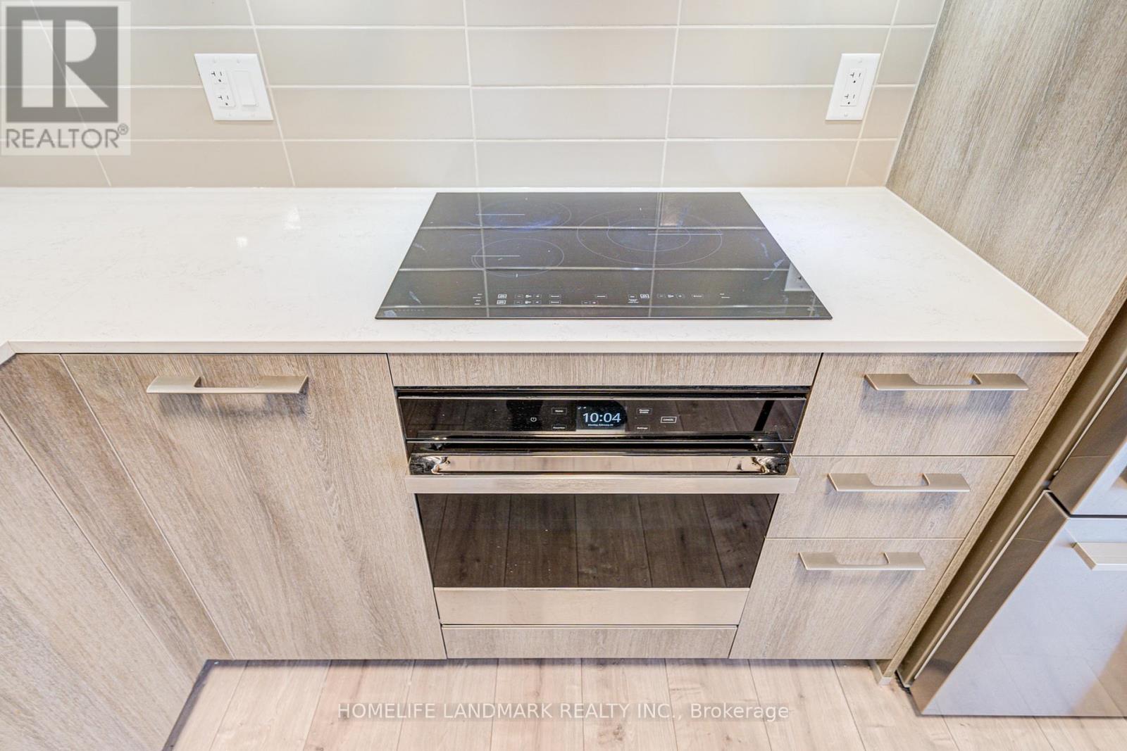 1009 - 18 Water Walk Drive, Markham, Ontario  L3R 6L5 - Photo 4 - N12685420