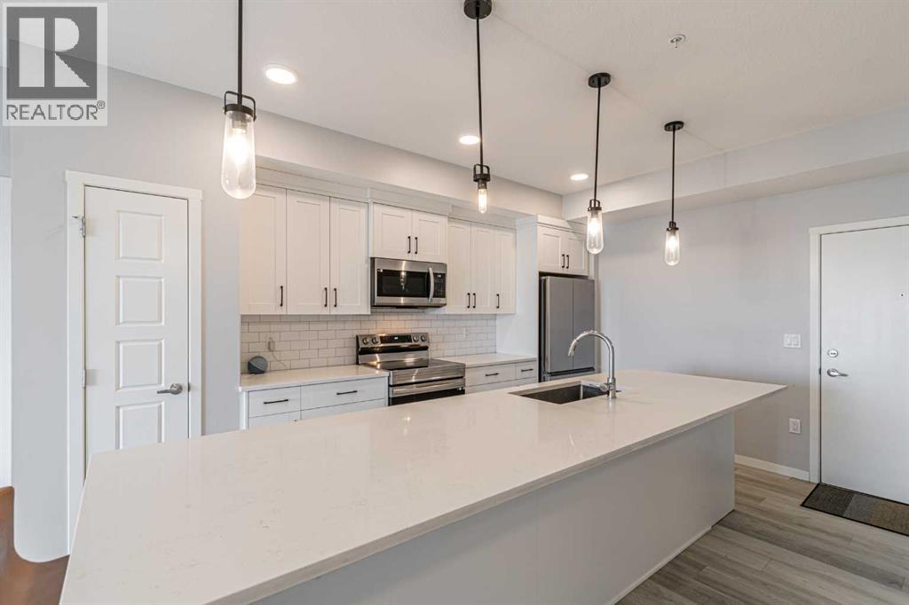 203, 360 Harvest Hills Way Ne, Calgary, Alberta  T3K 2S1 - Photo 5 - A2278153
