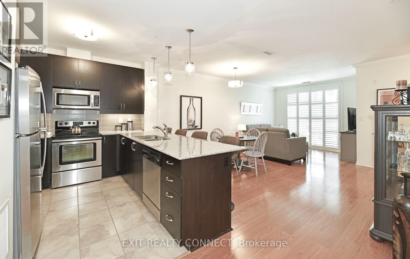 112 - 383 Main Street E, Milton, Ontario  L9T 8K8 - Photo 1 - W12690572