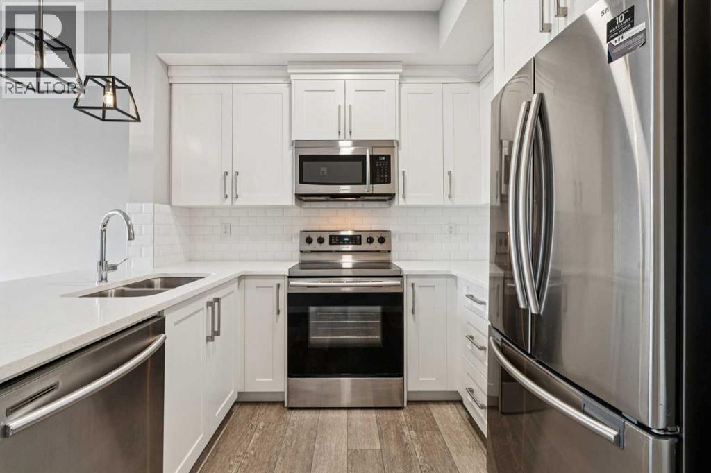 407, 370 Harvest Hills Common Ne, Calgary, Alberta  T3K 2M8 - Photo 9 - A2278506