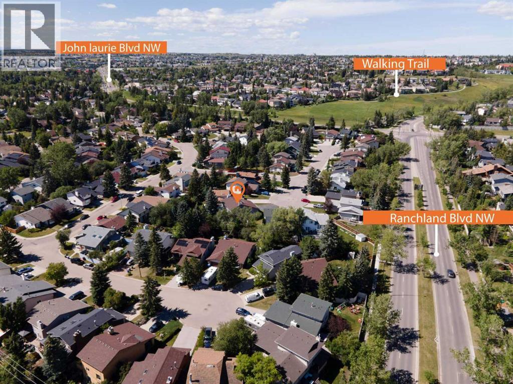 303 Ranchridge Bay Nw, Calgary, Alberta  T3G 1V5 - Photo 5 - A2278074