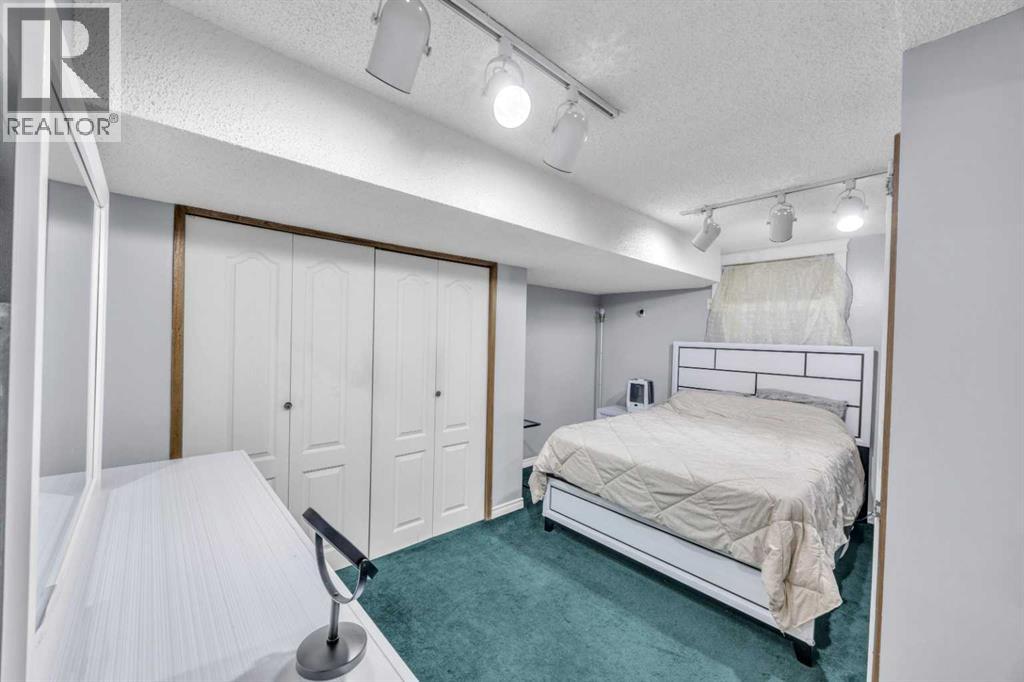 303 Ranchridge Bay Nw, Calgary, Alberta  T3G 1V5 - Photo 35 - A2278074