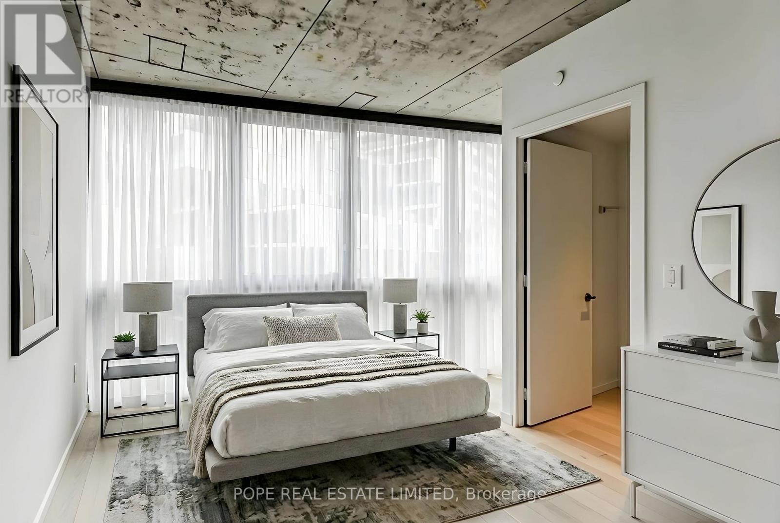 811 - 21 Lawren Harris Square, Toronto, Ontario  M5A 1H7 - Photo 3 - C12693944