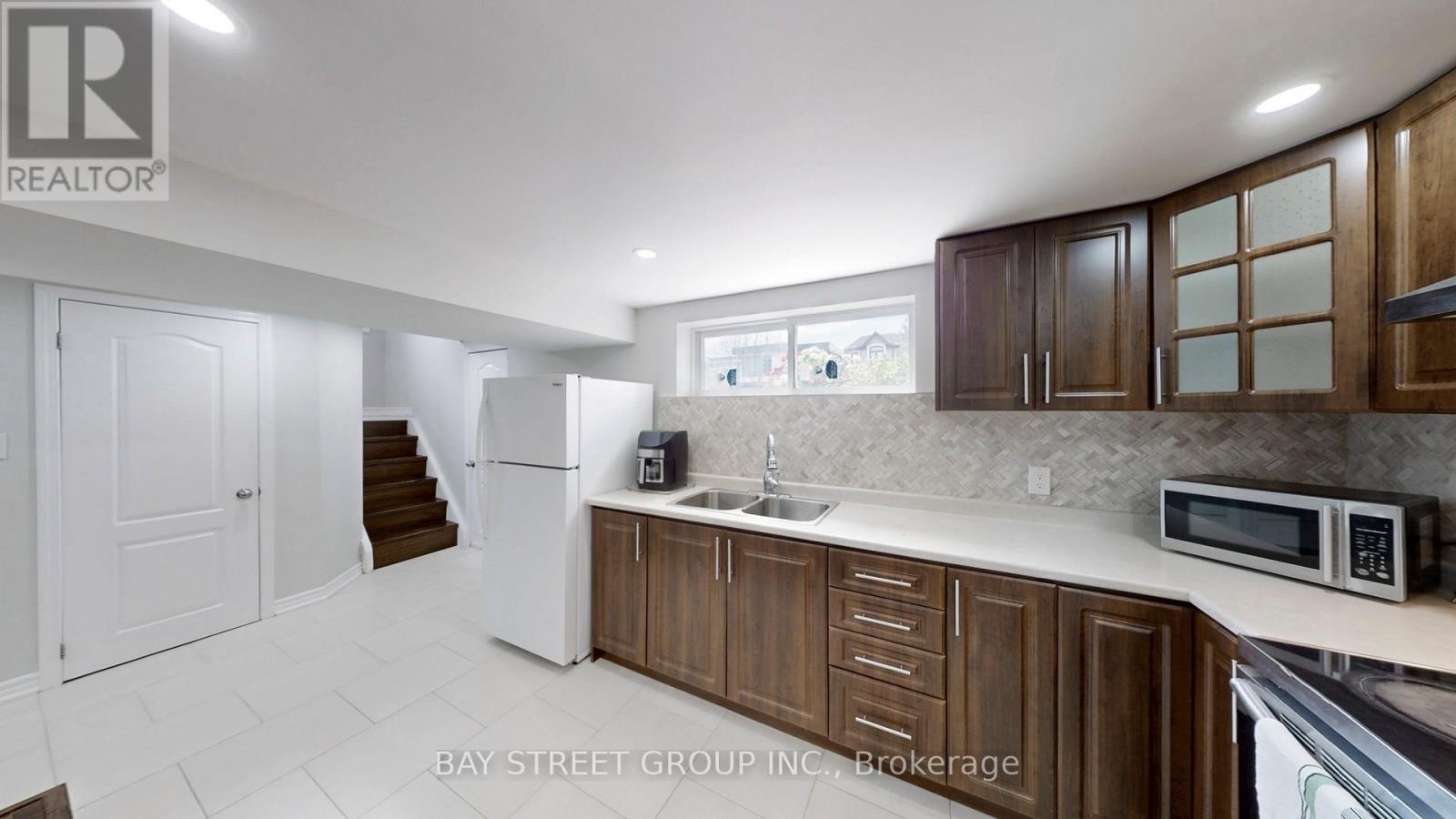 15 Macleod Street, Toronto, Ontario  M6L 2M7 - Photo 19 - W12695250