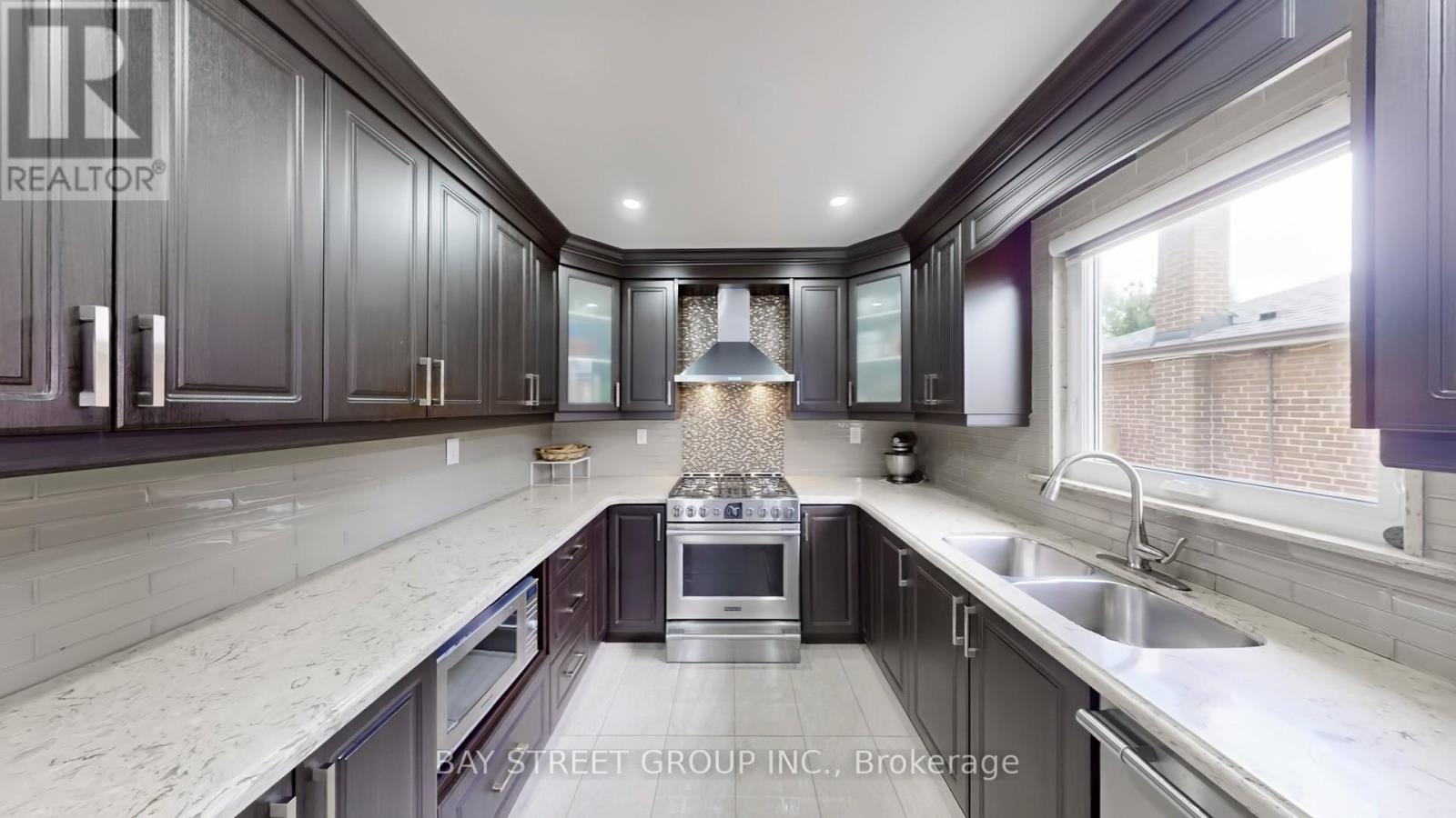 15 Macleod Street, Toronto, Ontario  M6L 2M7 - Photo 5 - W12695250