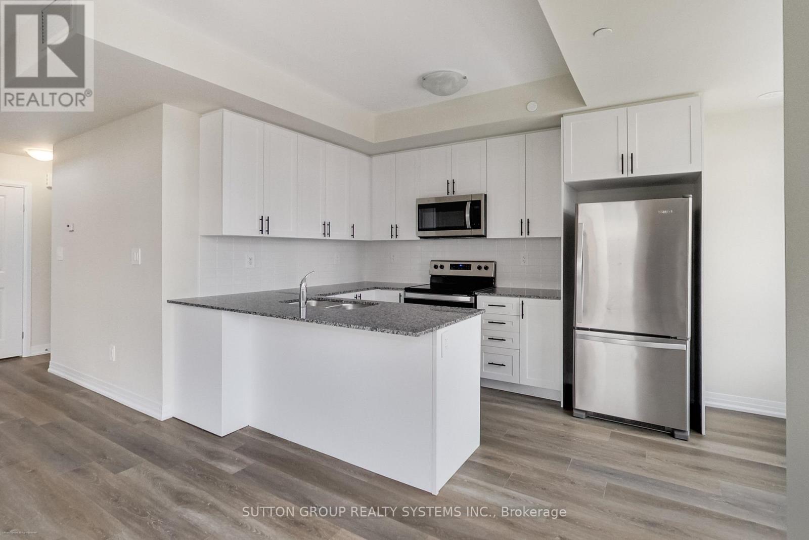 102 - 1593 Rose Way, Milton, Ontario  L9E 0J2 - Photo 3 - W12697614